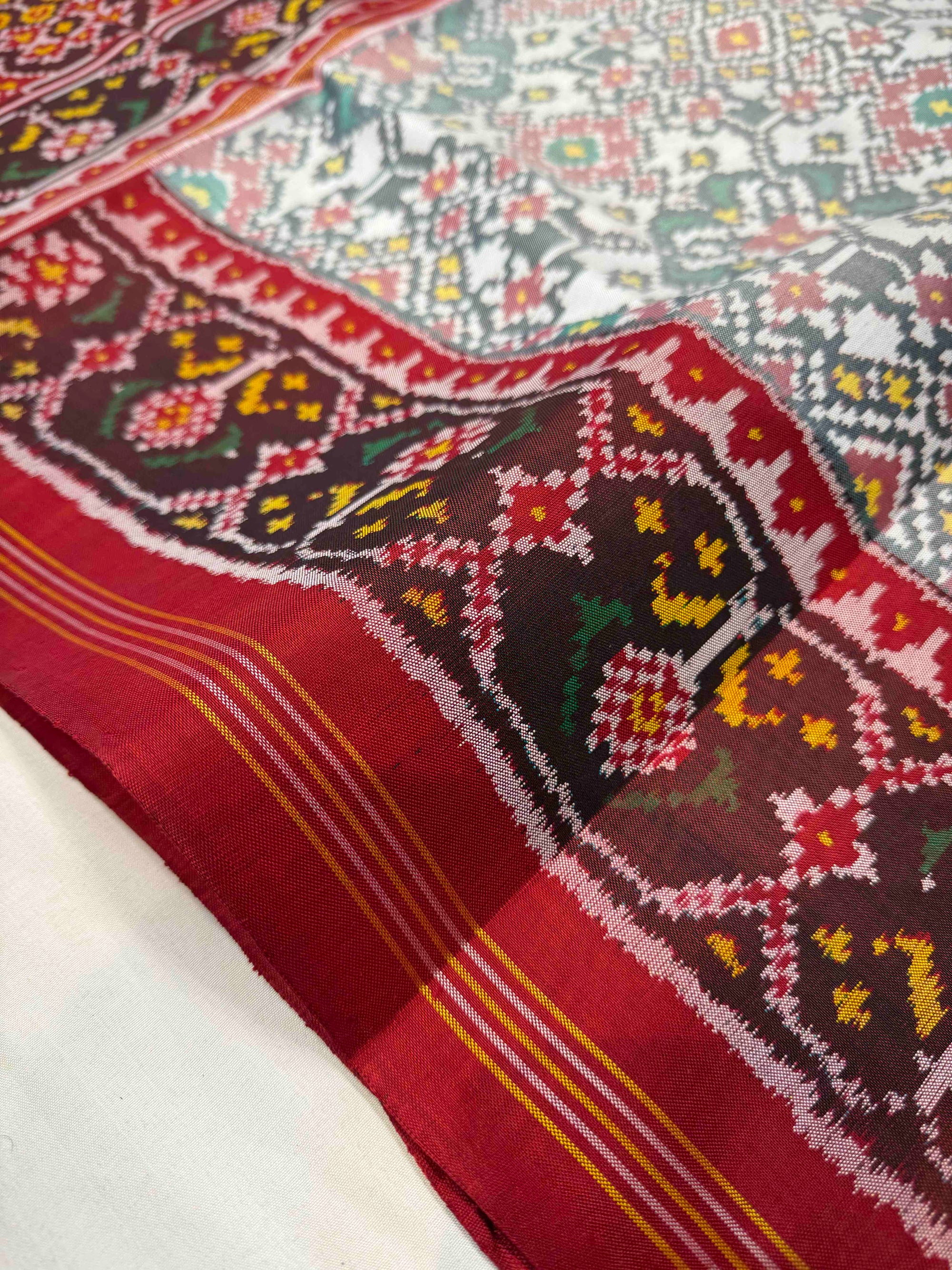 White & Red Navratan Design Hand Woven Ikat Patola Silk Saree