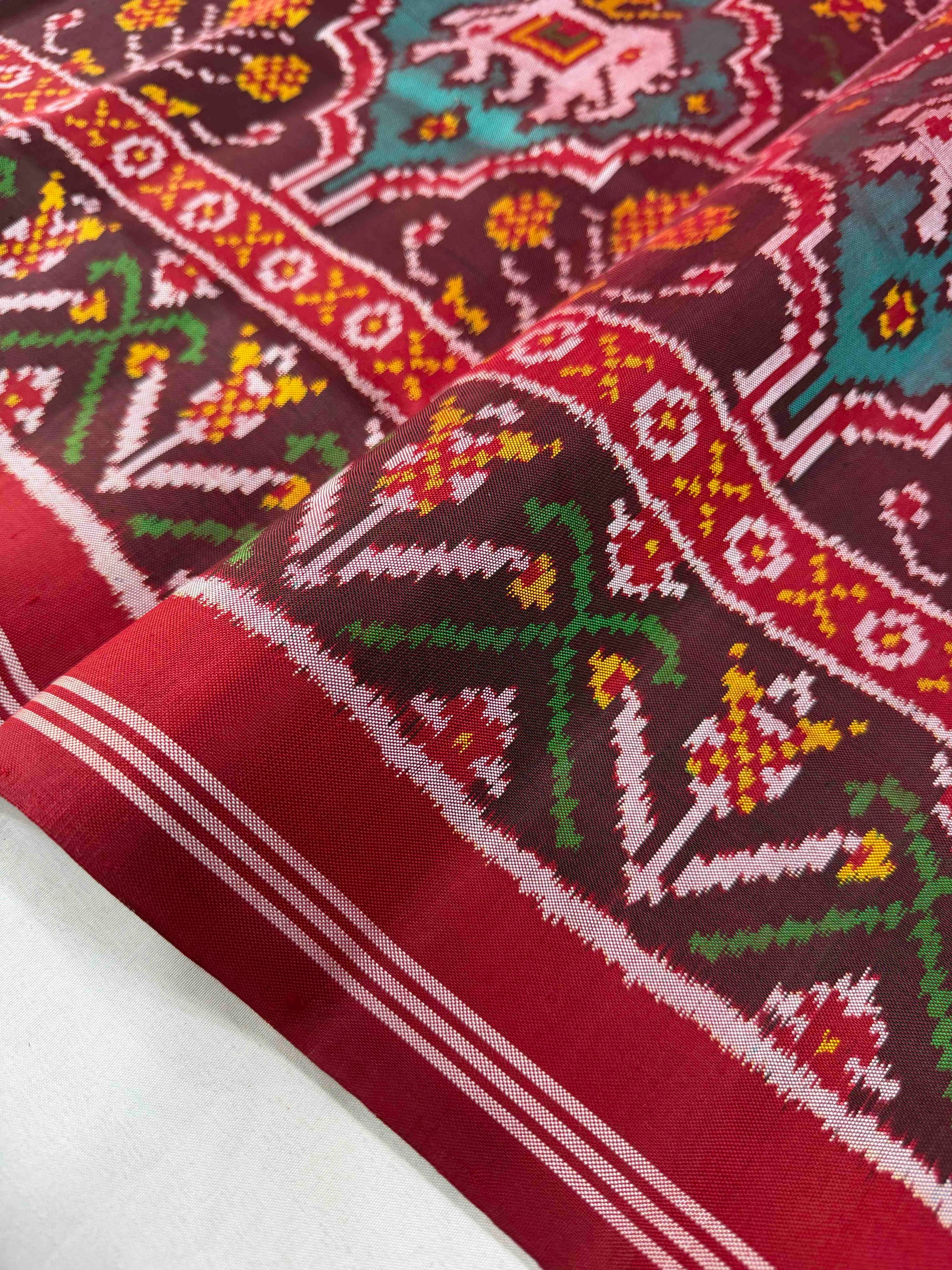 Maroon And Red Motifs Design Hand Woven Rajkot Ikat Patola Silk Saree