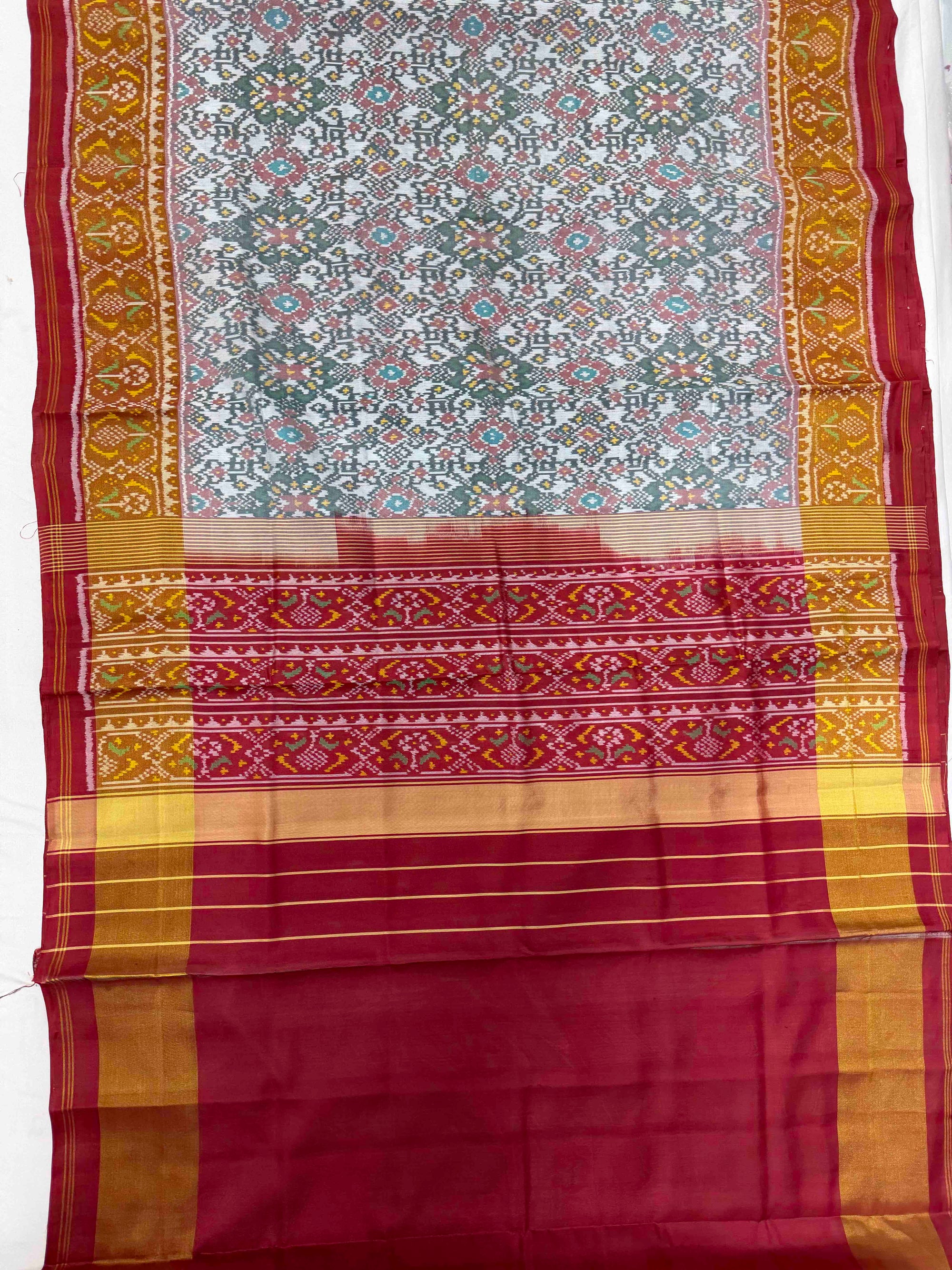 White And Red Navratan Hand Woven Rajkot Patola Silk Saree
