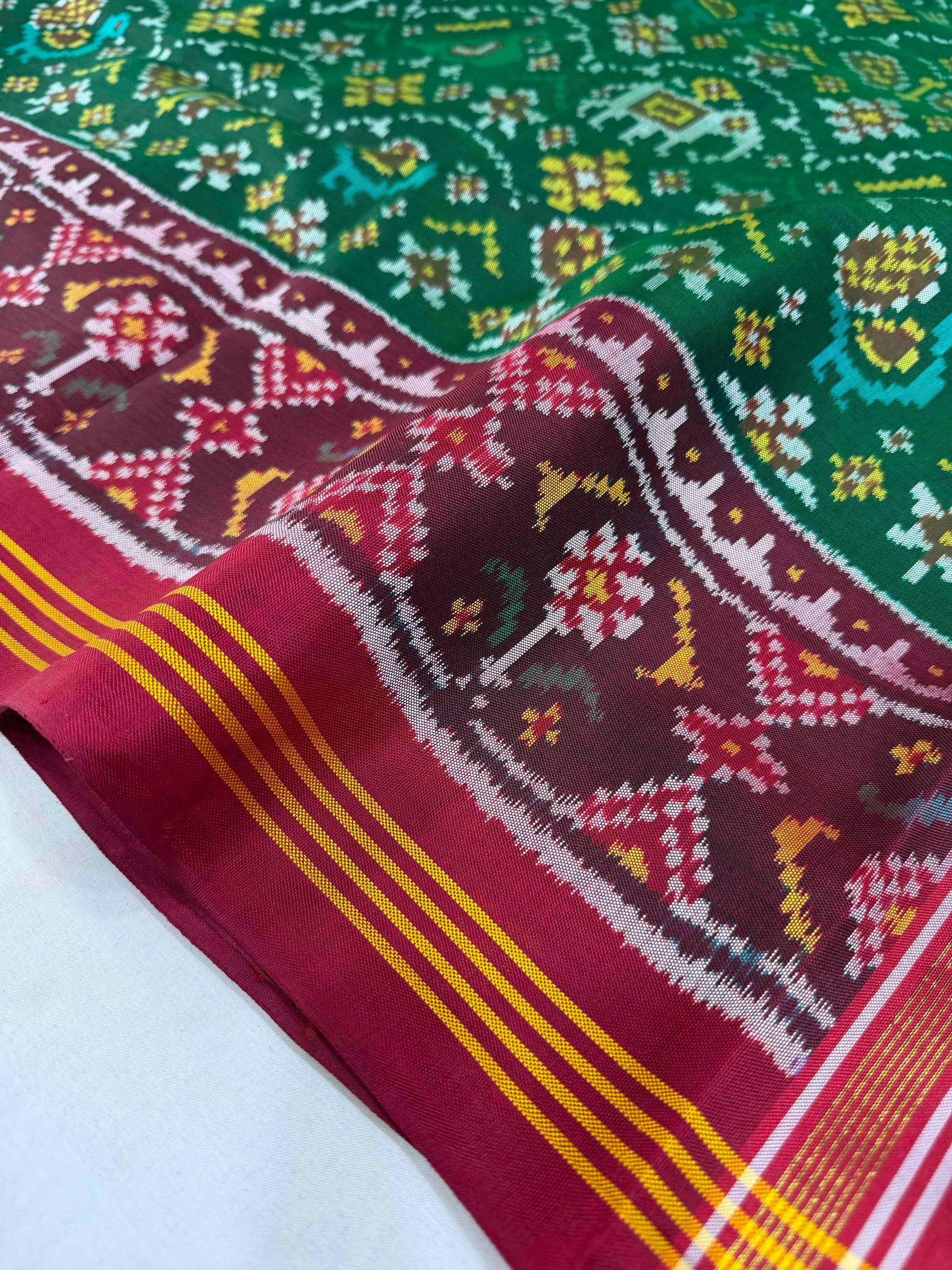 Green And Red Maroon Small Motifs Design Hand Woven Rajkot Ikat Patola Silk Saree
