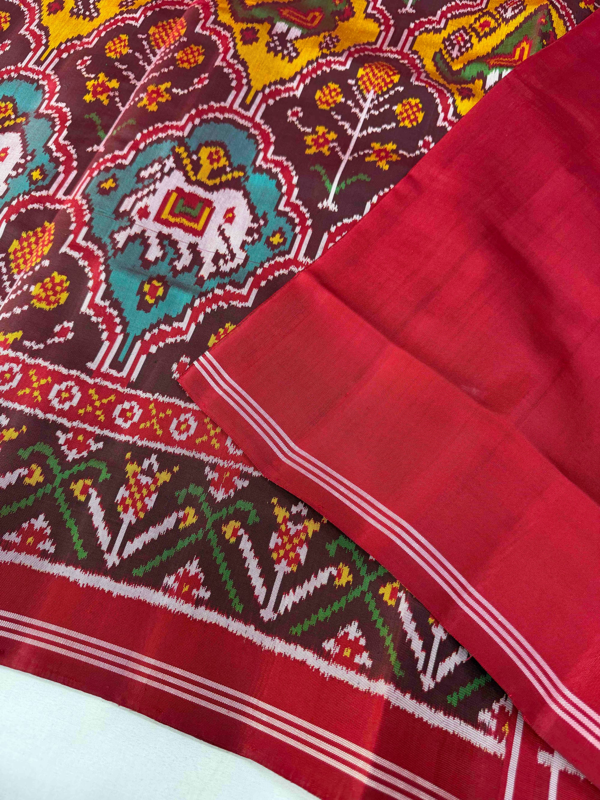 Maroon And Red Motifs Design Hand Woven Rajkot Ikat Patola Silk Saree