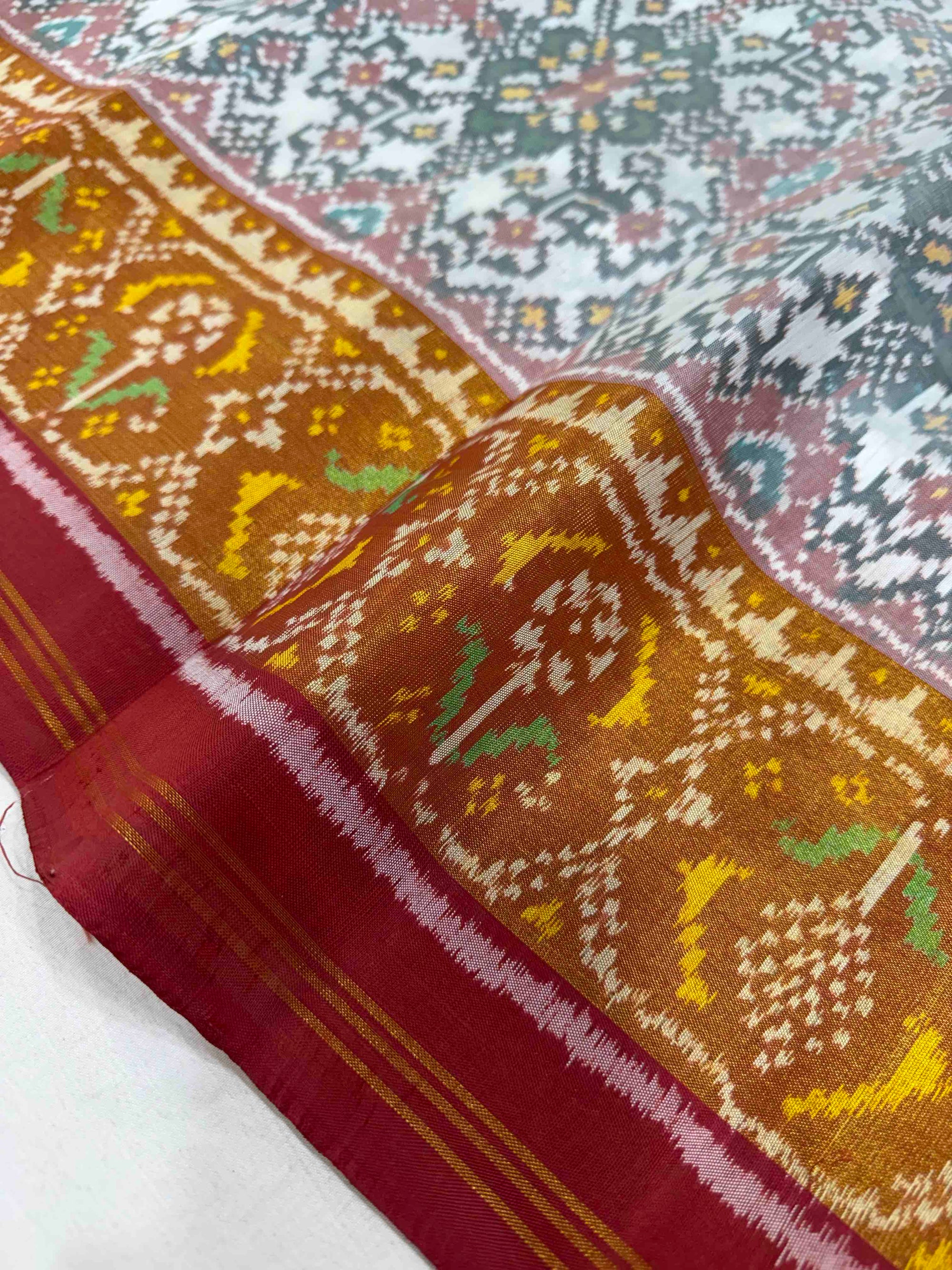 White And Red Navratan Hand Woven Rajkot Patola Silk Saree